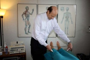 Acupuncture without needles: Dr. Mitchell uses electronic probes to diagnose the body’s imbalances as well as to treat the patient.